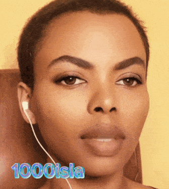 a close up of a woman 's face with the words 1000 isla written on the bottom