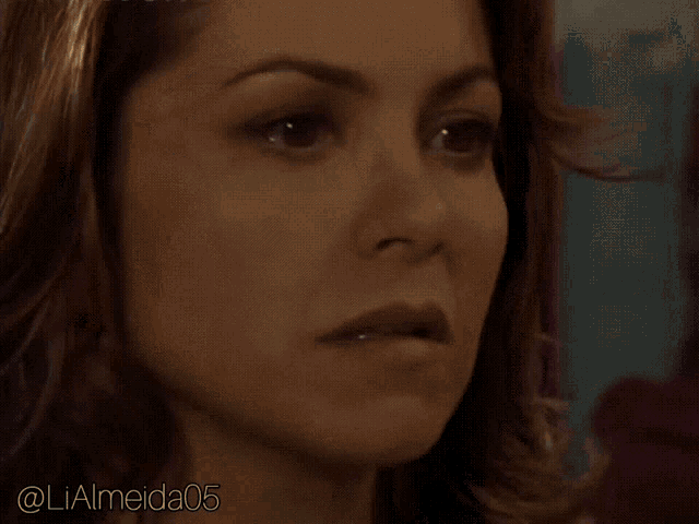 a close up of a woman 's face with the name lialmeida05 on the bottom