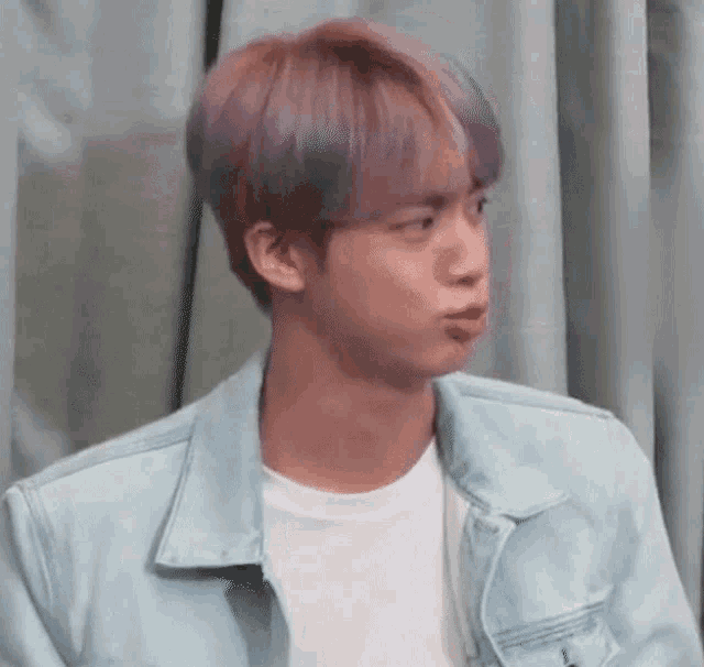 a close up of a person making a funny face .