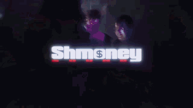 a person is holding a red object with the word shmoney on it