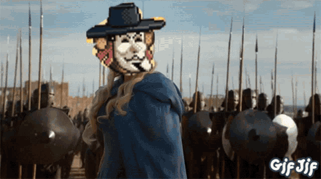 a gif of a man in a cowboy hat standing in front of a army