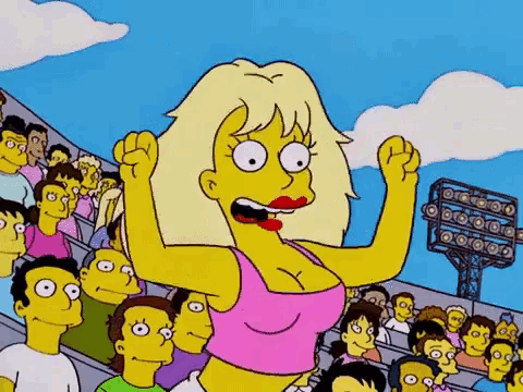a woman in a pink tank top is cheering in front of a crowd .