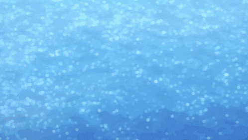a person 's hand is reaching out towards the water