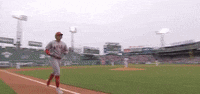 a blurry picture of a baseball player running on a field .