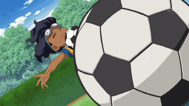 a cartoon of a person kicking a soccer ball with a tv channel visible in the background