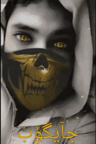 a person wearing a mask with a skull on it and arabic writing