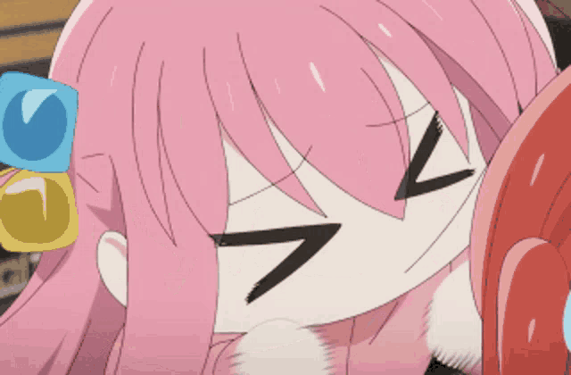 a girl with pink hair is making a funny face