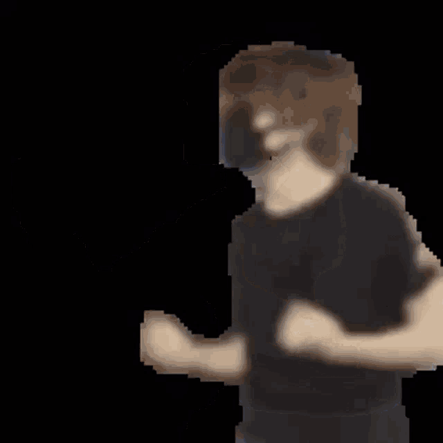 a man in a black shirt and blue jeans is dancing .