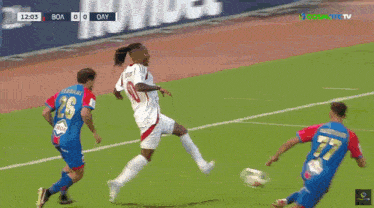 a soccer game is being played on a field with ads for novibet and admiral