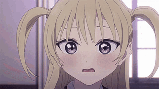 a close up of a blonde anime girl making a funny face