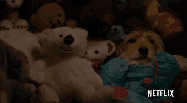 a dog is laying in a pile of stuffed animals with a netflix logo in the background