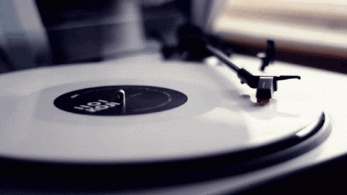 a record player is playing a record which says hot rod on it