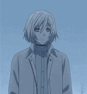 a man with short white hair is wearing a jacket and a choker .