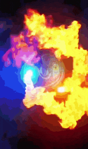 a painting of a colorful explosion with a blue light coming out of the center