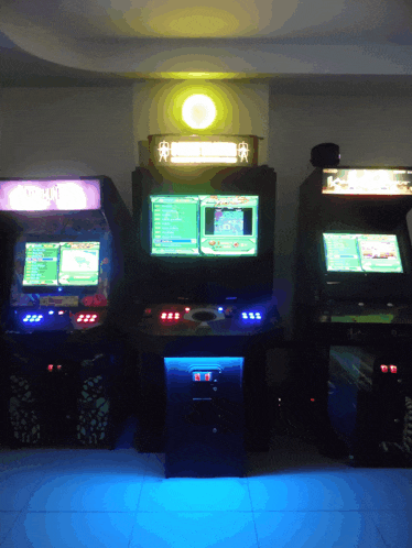 a row of arcade machines with one that says ' arcade ' on the top