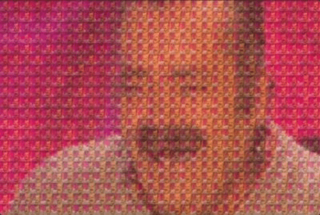 a close up of a mosaic of a man 's face with a beard .