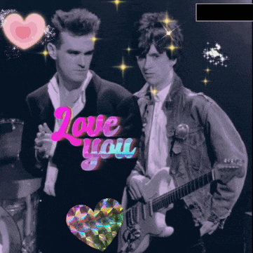 a couple of men standing next to each other with the words love you behind them