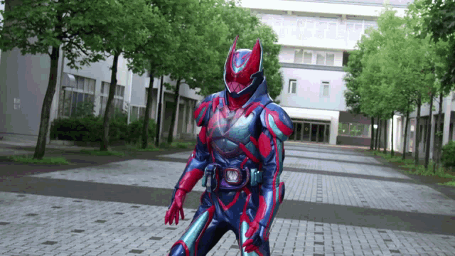 a person in a blue and red costume is walking down a brick walkway