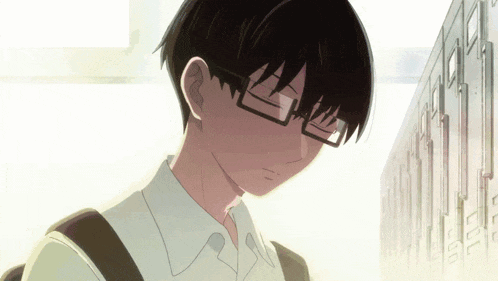 a boy wearing glasses is standing in front of a row of lockers that say left