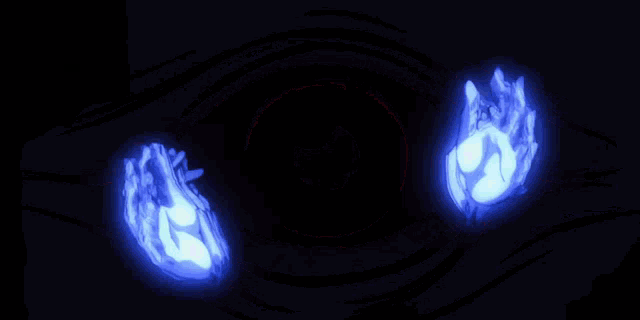 a pair of hands glowing in the dark