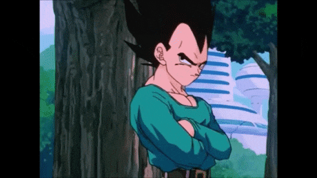 vegeta from dragon ball z is standing in front of a tree with his arms crossed
