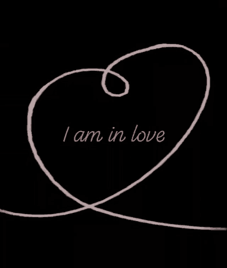 a black background with the words i am in love written in pink