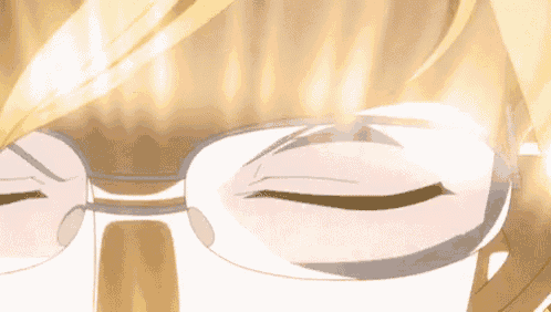a close up of a person wearing glasses with the sun shining through