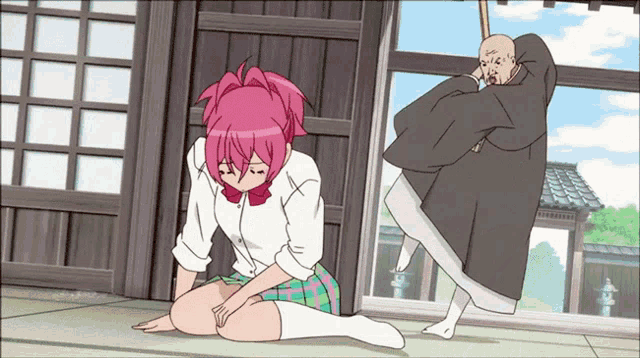 a girl with pink hair is kneeling down next to a man