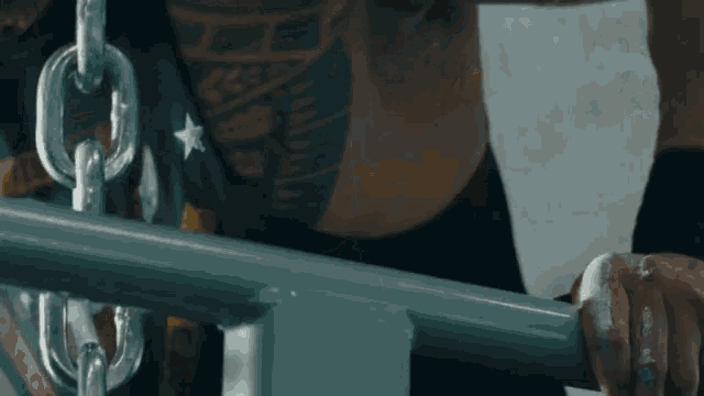 a close up of a person 's arm with a tattoo on it