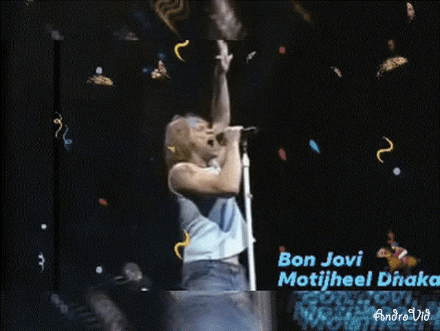 a man singing into a microphone with the name bon jovi on the bottom