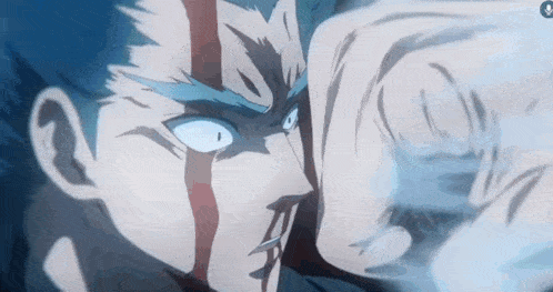 a close up of a person 's face with blood on it and a fist .