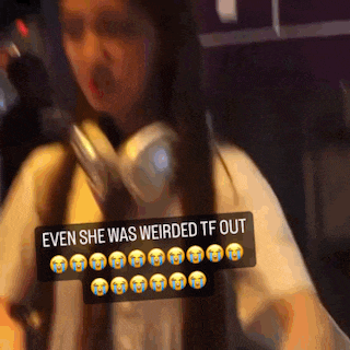 a woman is wearing headphones and has a sticker that says even she was weirded tf out