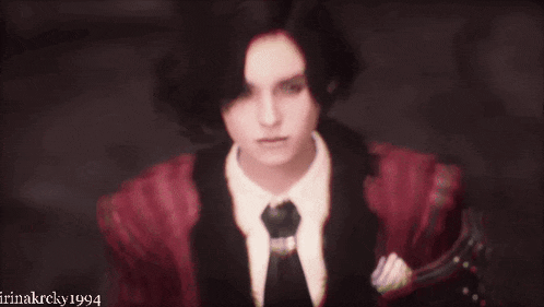 a woman in a red jacket and tie with the year 1994 on the bottom