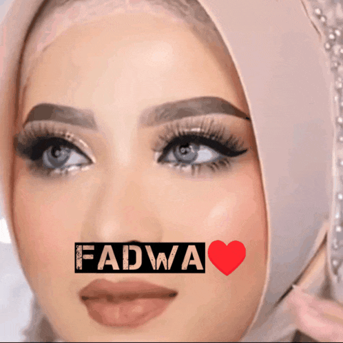 a close up of a woman 's face with the name fadwa on it