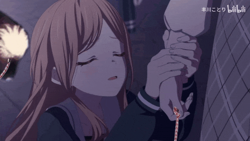 a girl is holding a man 's hand with chinese writing on the bottom