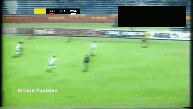 a soccer game is being played in tunisie and the score is 3-1