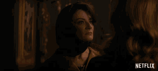 a woman with a scarf around her head says you 're a pathetic lot