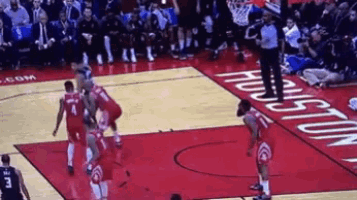 a basketball game is being played on a court with the word houston on it