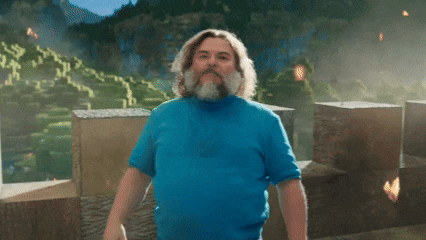 a man in a blue shirt says i am in front of a mountain