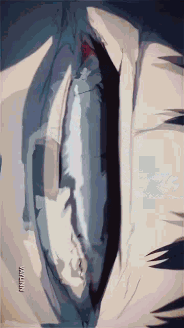 a close up of a person 's face with a blurred background and a watermark on the bottom right corner