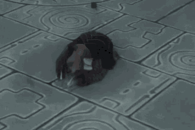 a video game character is laying on a brick floor with a swirl pattern on it