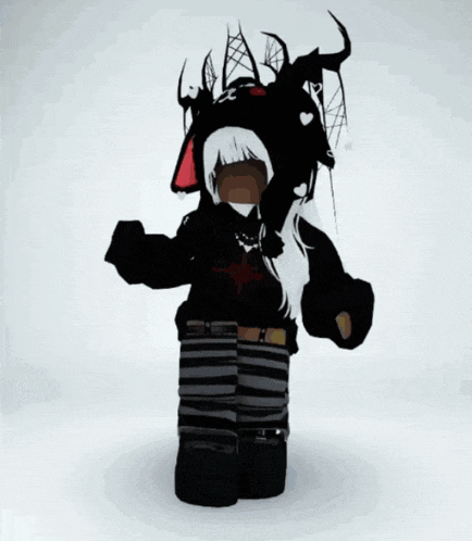 a girl is wearing a black hoodie and a black hat with horns
