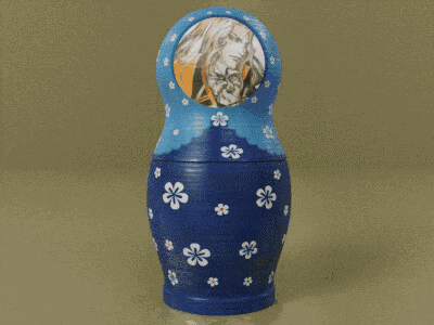 a blue green and orange russian nesting doll with flowers on it