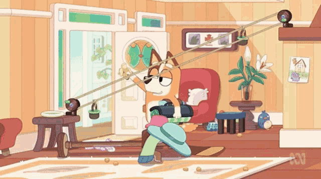 a cartoon dog is sitting in a chair in a living room holding a gun .