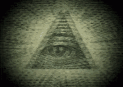 a close up of an all seeing eye in a triangle on a wall .