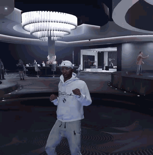 a man wearing a white diamond hoodie stands in a room