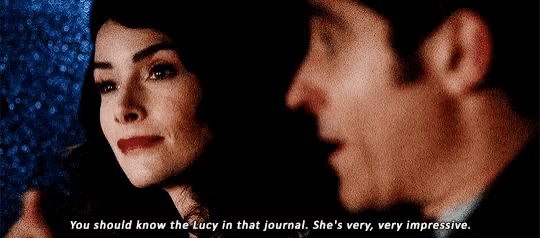 a man and a woman are talking to each other and the woman says `` you should know the lucy in that journal .