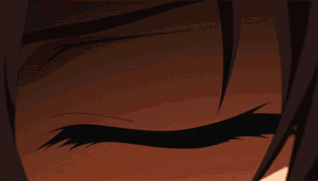 a close up of a person 's red eye with the letter u on it