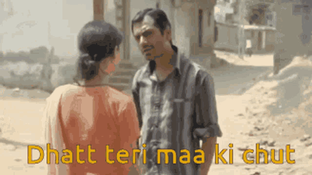 a man and a woman are standing next to each other with the words " dhath teri maa ki chut " written on the bottom