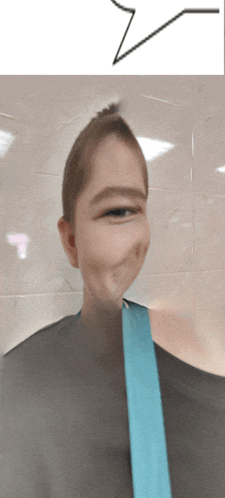 a blurry picture of a person with a blue strap around their shoulder